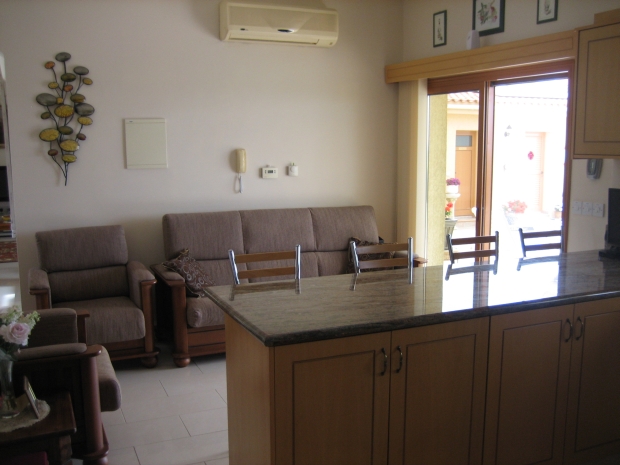 Kitchen Sitting Area with Patio Door Leading to Pool